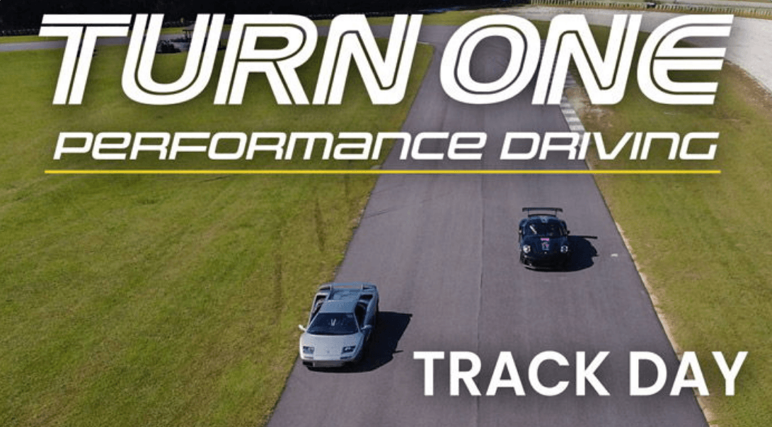 trackday.png - Experience Camden, South Carolina Promotional banner for Turn One Performance Driving Track Day with two cars racing on a track from above.