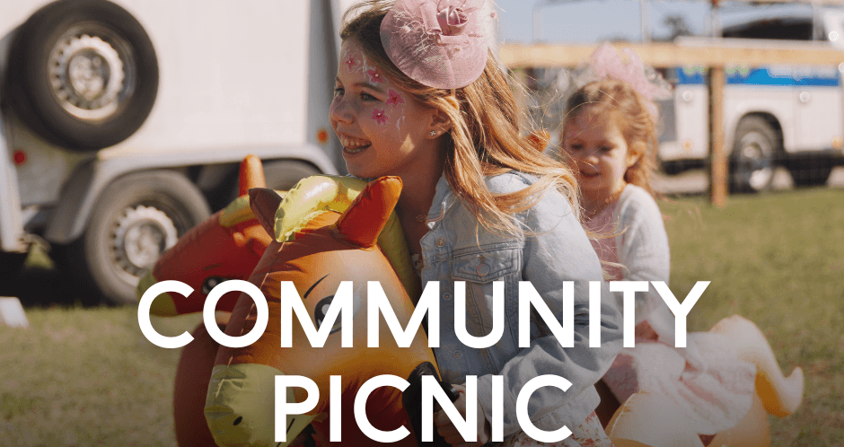 914.png - Experience Camden, South Carolina Two smiling young girls with face paint and hair fascinators bounce on inflatable horse toys at an outdoor event. Text reads: COMMUNITY PICNIC, FOOD GAMES FUN, SEP 19, 11:30-2 P.M.