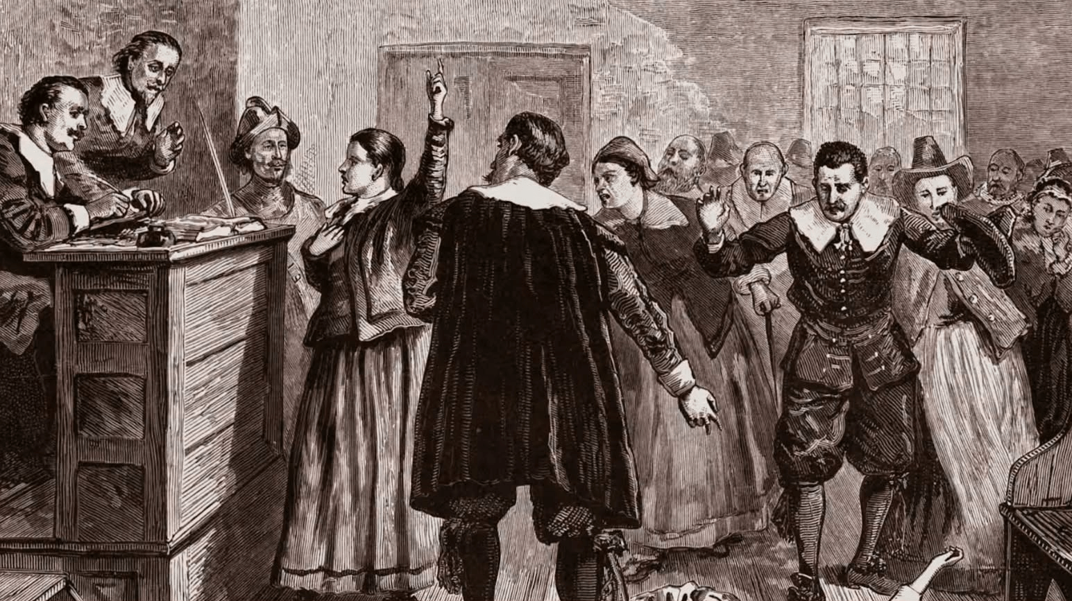 horsesandhexes2 - Experience Camden, South Carolina A courtroom scene shows people in period clothing accusing and defending, with a woman raising her hand. A judge listens from a raised desk as the crowd reacts emotionally. The setting suggests a historical trial.